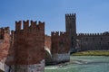 View of the Castel Vecchio Bridge connected to Castelvecchio Castle along Adige river in Verona, Italy - July, 2022 Royalty Free Stock Photo